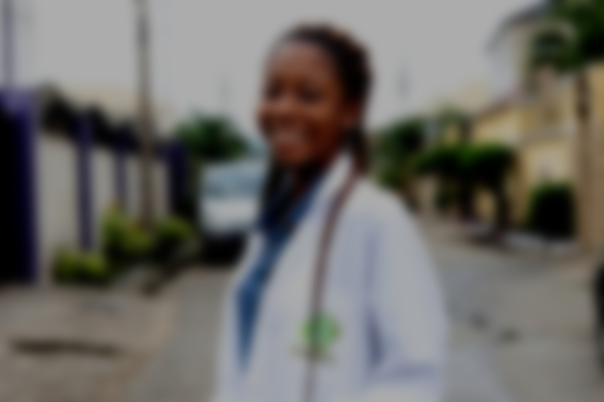 Smiling Woman Wearing a Medical Gown