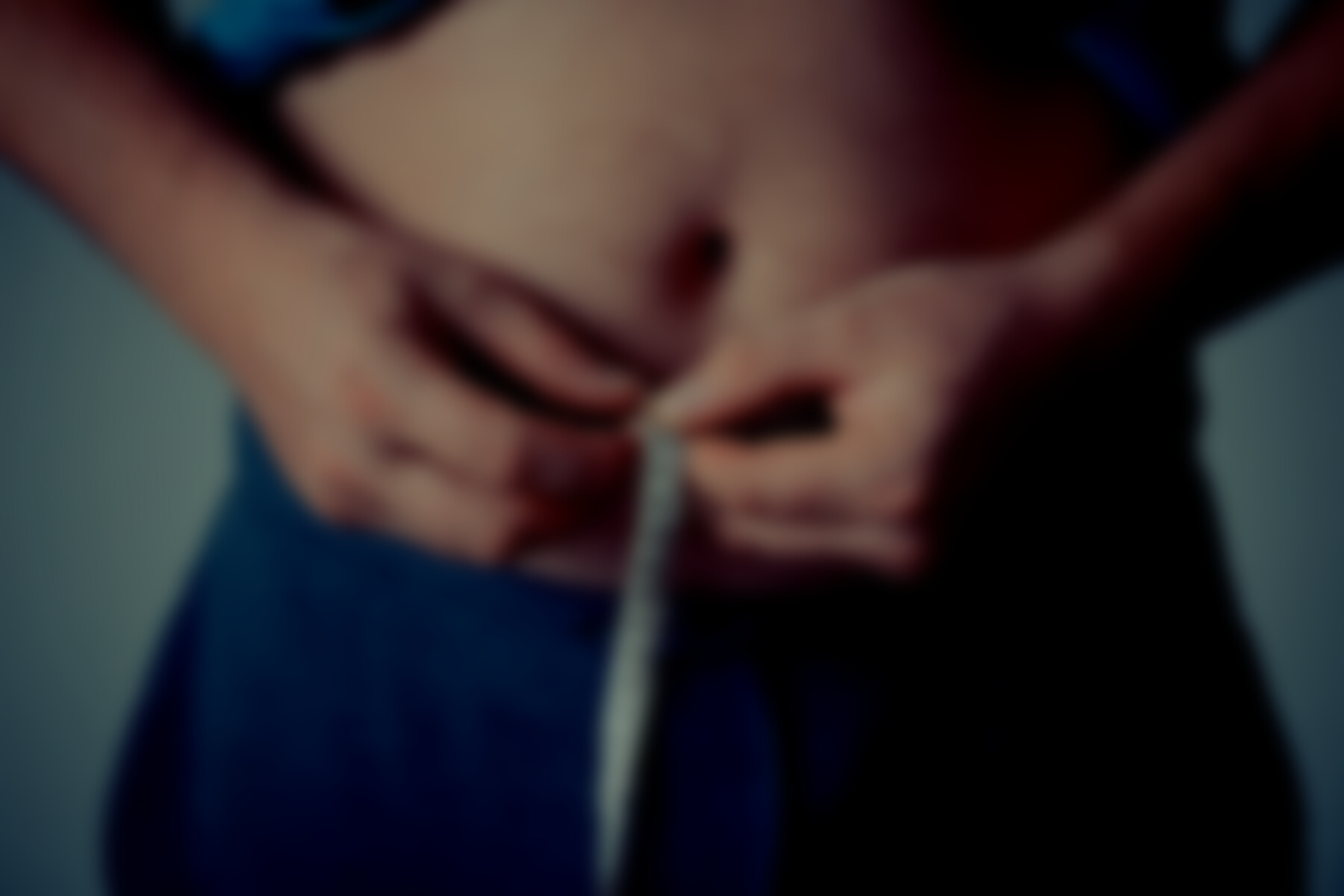 Person Holding Measuring Tape Around His Body